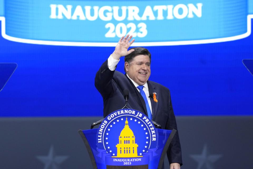 Illinois Gov. J.B. Pritzker waves to crowd after delivering his inaugural address during ceremonies Monday, Jan. 9, 2023, in Springfield, Ill. (AP Photo/Charles Rex Arbogast)