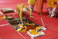 Indian Prime Minister Narendra Modi performs rituals during the groundbreaking ceremony of a temple dedicated to the Hindu god Ram, in Ayodhya, India, Wednesday, Aug. 5, 2020. Hindus rejoiced as Modi broke ground on a long-awaited temple of their most revered god, Ram, at the site of a demolished 16th century mosque. (AP Photo/Rajesh Kumar Singh)