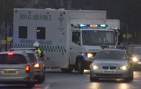 A convoy carrying a female Ebola patient arrives at the Royal Free Hospital in London December 30, 2014. REUTERS/Neil Hall