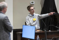 Michael Tony Satterfield, son of Gloria Satterfield, points out Alex Murdaugh during Murdaugh's double murder trial at the Colleton County Courthouse in Walterboro, S.C., Friday, Feb. 3, 2023. The 54-year-old attorney is standing trial on two counts of murder in the shootings of his wife and son at their Colleton County home and hunting lodge on June 7, 2021. (Sam Wolfe/The State, Pool)