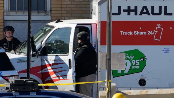 PHOTO: Members of the NYPD bomb squad examine a rental truck that was stopped and the driver arrested, Feb. 13, 2023, in New York. (John Minchillo/AP)