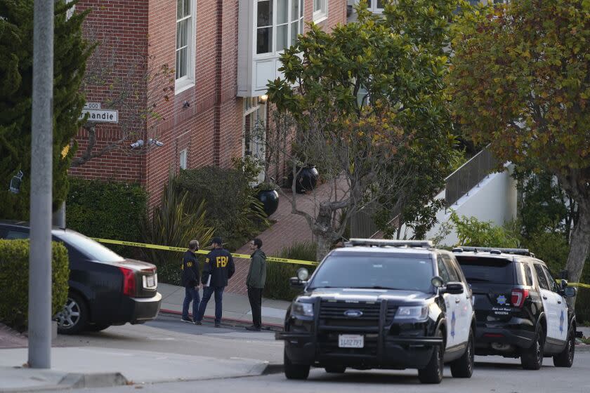 FBI agents outside the San Francisco home of House Speaker Nancy Pelosi on Oct. 28 after her husband, Paul Pelosi, was attacked by an assailant with a hammer who had broken in. (AP)
