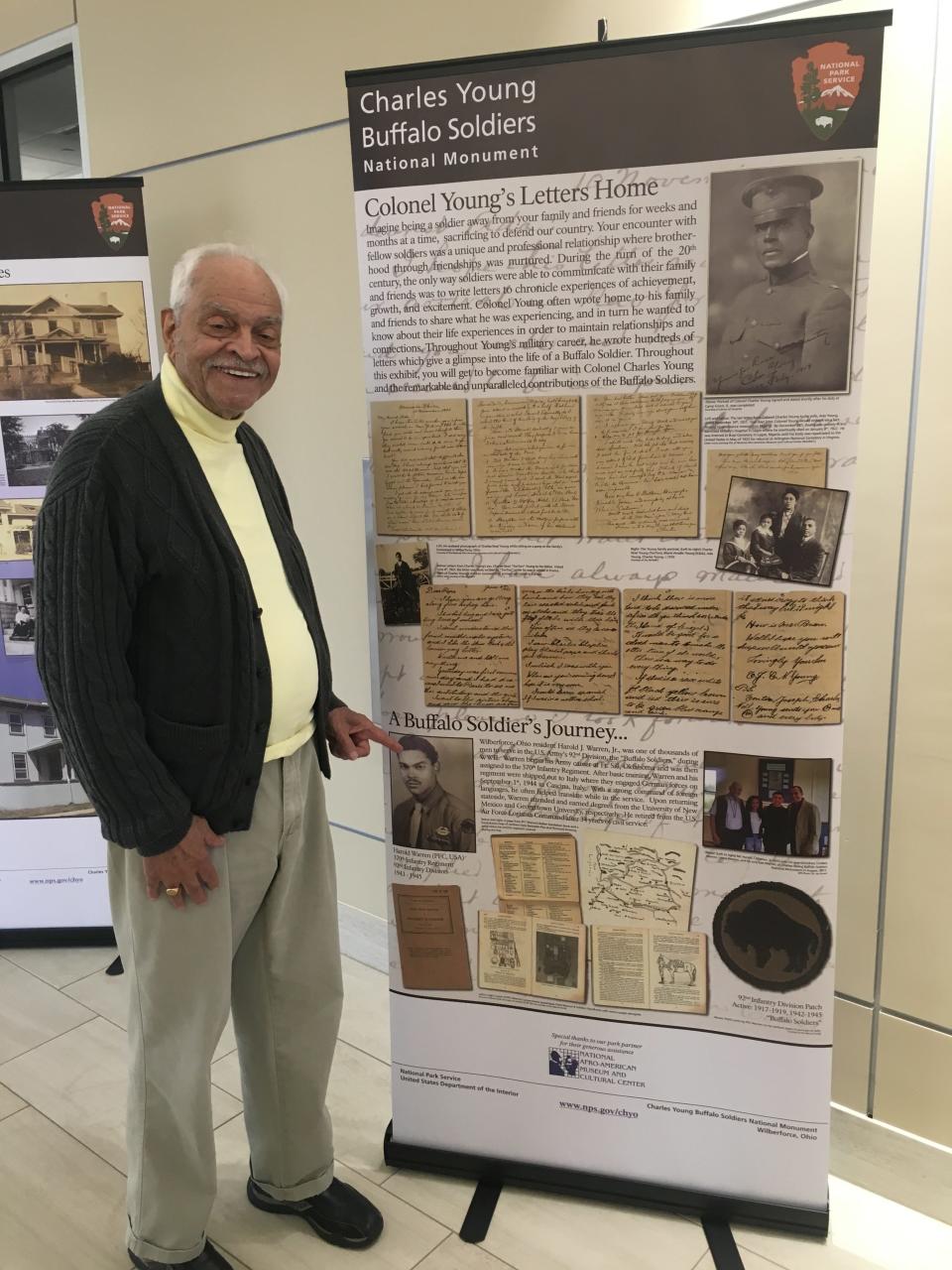 Harold J. Warren points to a display honoring his WWII service at the Charles Young Buffalo Soldiers National Monument in Ohio.