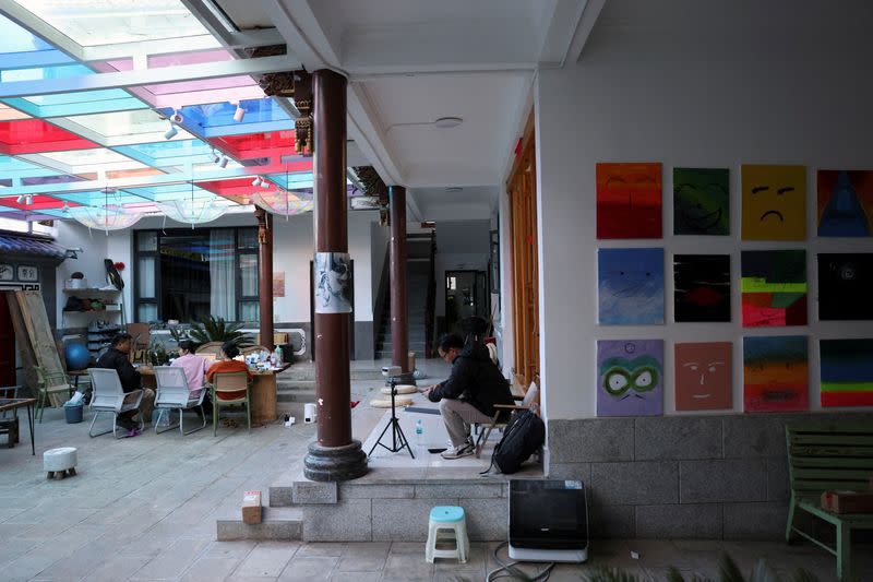 People work at a co-working hub for digital nomads in Dali