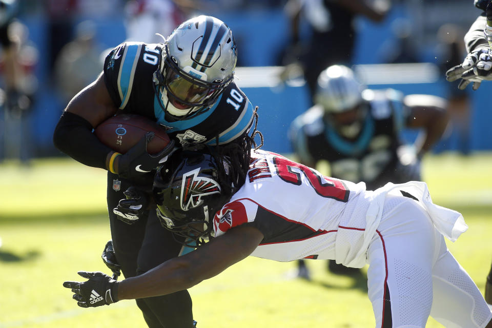 Carolina Panthers wide receiver Curtis Samuel (10) runs while Atlanta Falcons cornerback Desmond Trufant (21) tackles during the first half of an NFL football game in Charlotte, N.C., Sunday, Nov. 17, 2019. (AP Photo/Brian Blanco)