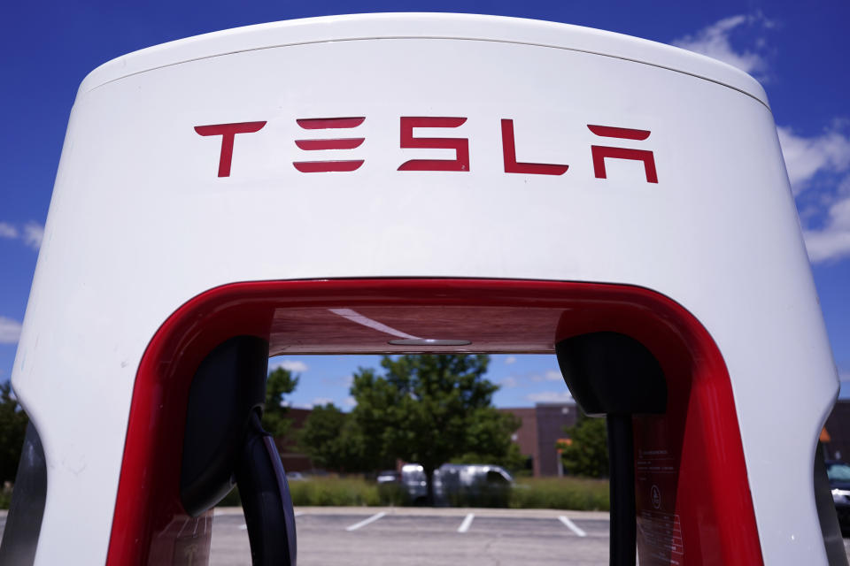A Tesla Supercharger is seen at Willow Festival shopping plaza parking lot Wednesday, Aug. 10, 2022, in Northbrook, Ill. (AP Photo/Nam Y. Huh)