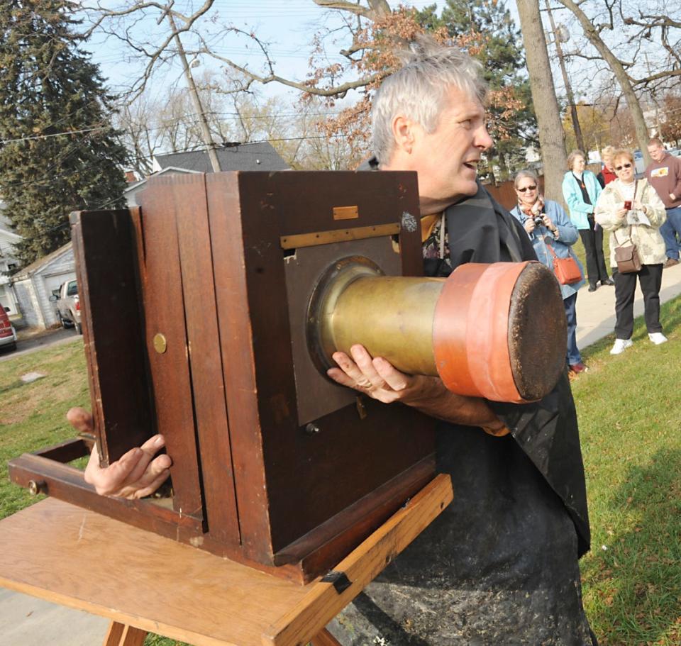 Photographer and historian Martin Bertera is shown in 2012 at Monroe's River Raisin National Battlefield Park. Bertera took photos of reenactors posing as veterans from the War of 1812 with his 1870s camera.