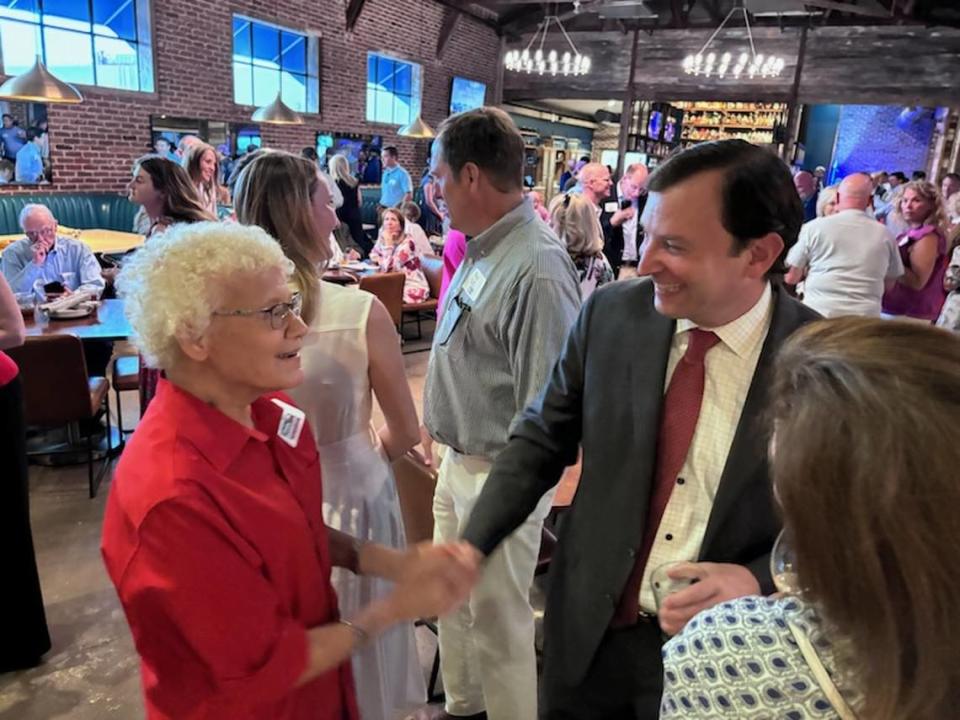 Arlington resident Donna Korman, 80, shakes John Goldman’s hand at his campaign watch part at a Fort Worth restaurant on Tuesday, May 28, 2024.