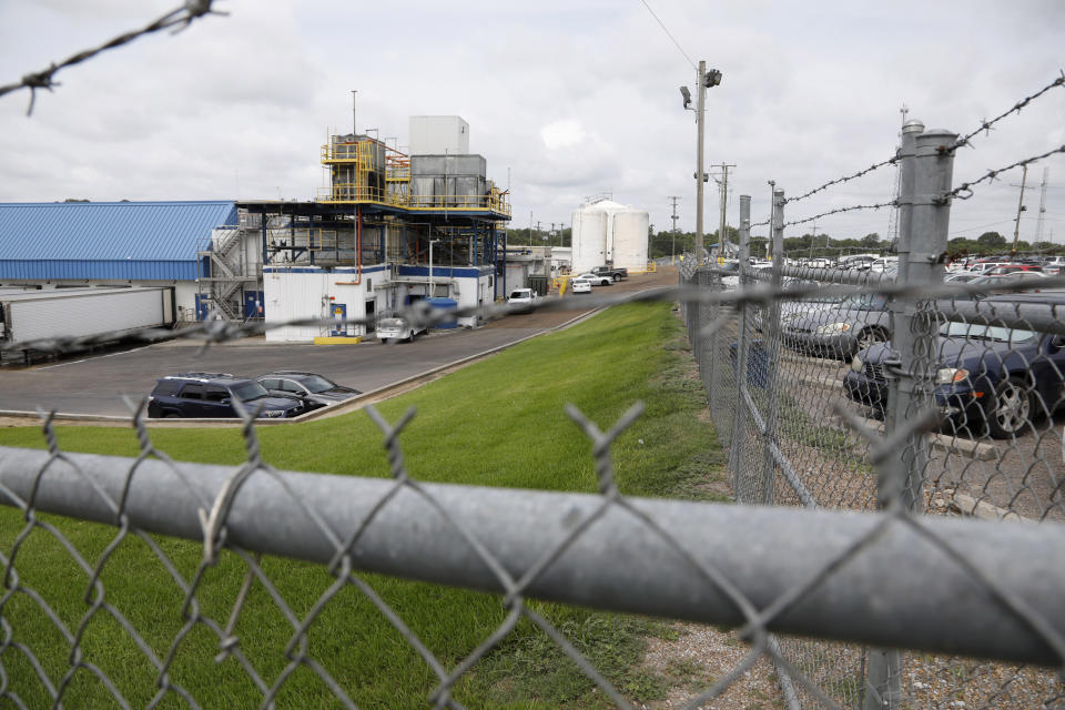 Business continues at this Koch Foods Inc., plant in Morton, Miss., Thursday, Aug. 8, 2019, following Wednesday's raid by U.S. immigration officials. In an email Thursday, U.S. Immigration and Customs Enforcement spokesman Bryan Cox said more than 300 of the 680 people arrested Wednesday have been released from custody. (AP Photo/Rogelio V. Solis)