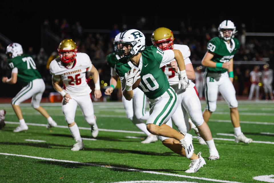 Ramapo QB James Magerko carries the ball for a long gain. He would later score to put Ramapo up 7- 0 in the 1st quarter.