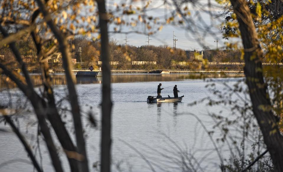 Anglers try their luck on the Mississippi River just above the Sartell dam in this 2017 file photo. 