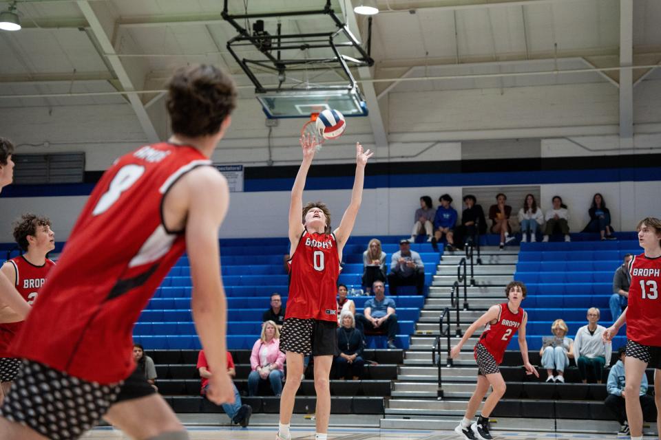 Brophy Broncos player Adam Matchinsky (0) sets the ball during a game against the Chandler Wolves on March 31, 2023, in Chandler, Ariz.