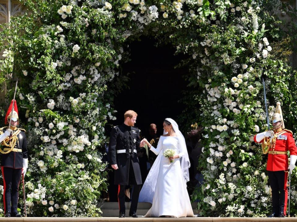 Prince Harry and Meghan Markle leave after their wedding ceremony at St. George's Chapel in Windsor Castle in Windsor, near London, England, Saturday, May 19, 2018.