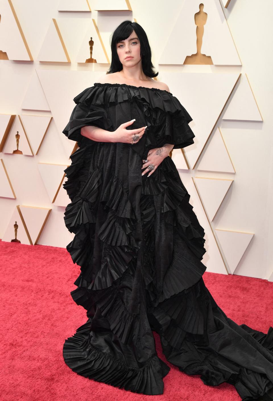  Eilish arrived in an off-the-shoulder, billowing ruffled look on the Oscars red carpet. (Photo by ANGELA  WEISS/AFP via Getty Images)