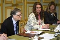 FILE PHOTO: Microsoft founder and billionaire philanthropist Bill Gates and his wife Melinda Gates attend a meeting with French President at the Elysee Palace in Paris