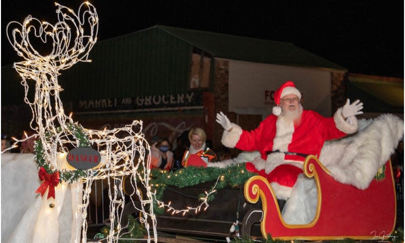 Santa waves to the crowd during the a past Christmas parade in downtown Crestview. This year's parade will be held on Saturday, Dec. 3 at 5:30 p.m.