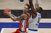 Syracuse's Marek Dolezaj, left, looks to pass as Pittsburgh's Abdoul Karim Coulibaly (12) defends during the second half of an NCAA college basketball game, Saturday, Jan. 16, 2021, in Pittsburgh. Pittsburgh won 96-76. (AP Photo/Keith Srakocic)