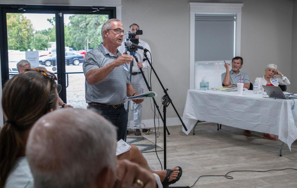 Incoming Santa Rosa County Commissioner Kerry Smith asks a question during a town hall meeting Aug. 8 about the proposed Jubilee Community Development District.