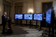 President Joe Biden speaks during a virtual swearing in ceremony of political appointees from the State Dining Room of the White House on Wednesday, Jan. 20, 2021, in Washington. (AP Photo/Evan Vucci)