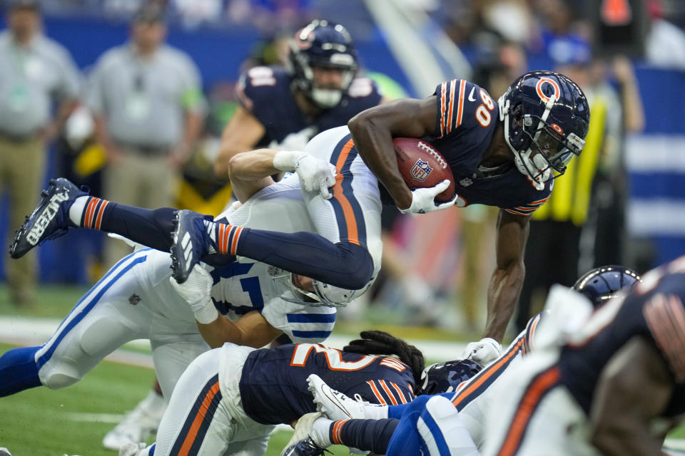 Chicago Bears wide receiver Joe Reed, right, is grabbed by Indianapolis Colts' Jake Funk, left, on a kick return during the first half of an NFL preseason football game in Indianapolis, Saturday, Aug. 19, 2023. (AP Photo/Michael Conroy)