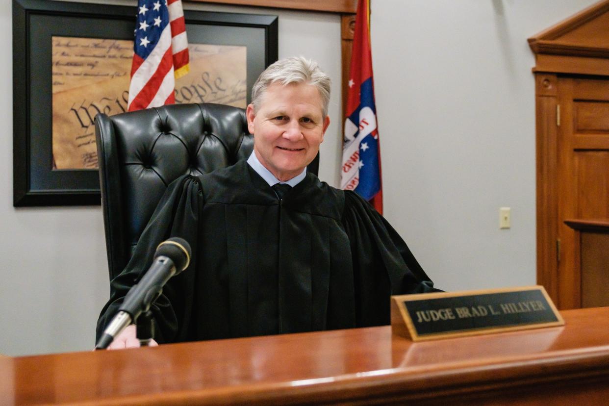 Judge Brad L. Hillyer, who retired Monday, sits for a portrait in his courtroom at the Tuscarawas County Court/Southern District in Uhrichsville.