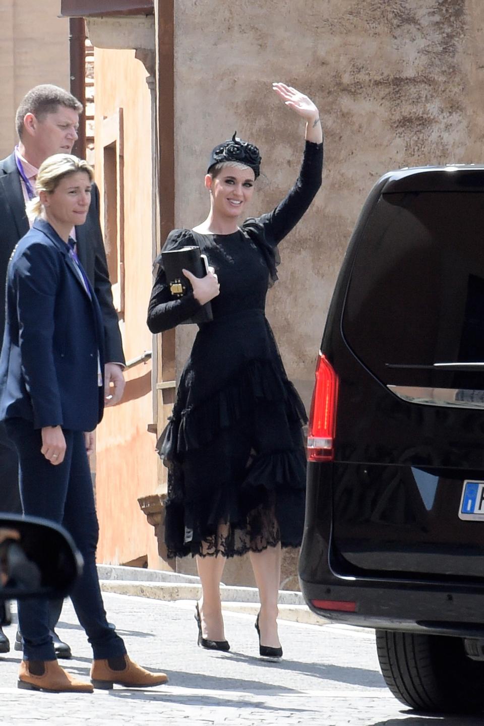 The on-again couple sported complementary looks on a Roman holiday.