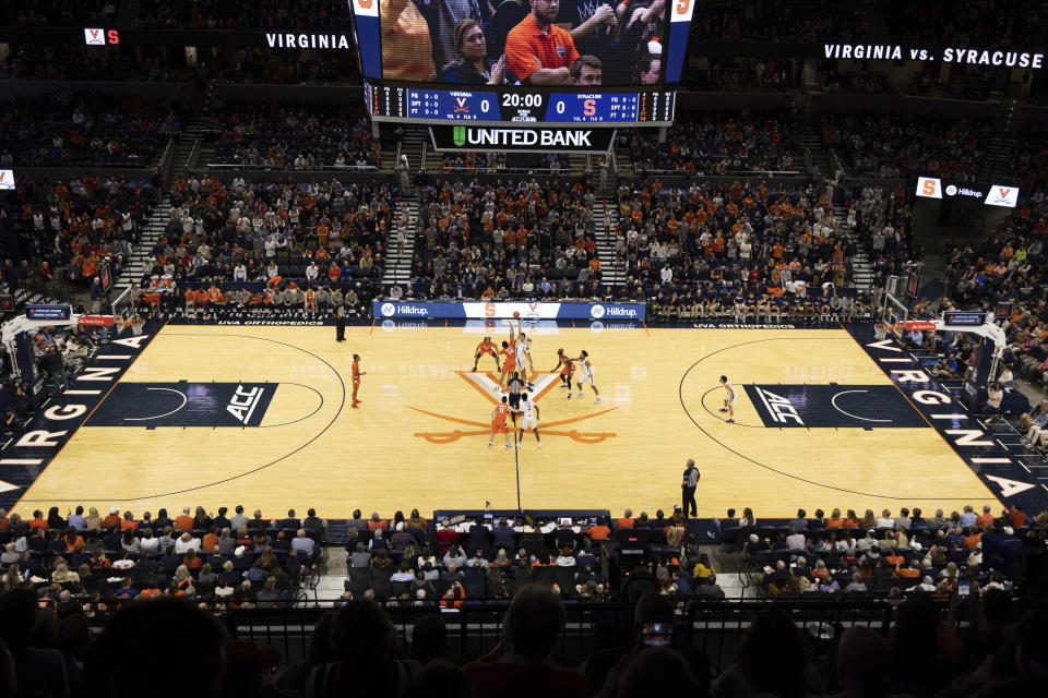 Virginia and Syracuse tip off during the first half of an NCAA college basketball game in Charlottesville, Va., Saturday, Jan. 7, 2023. (AP Photo/Mike Kropf)