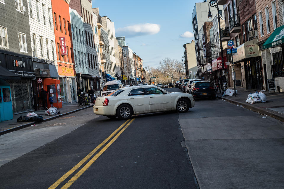 Car performing u-turn in the street. Source: Getty Images