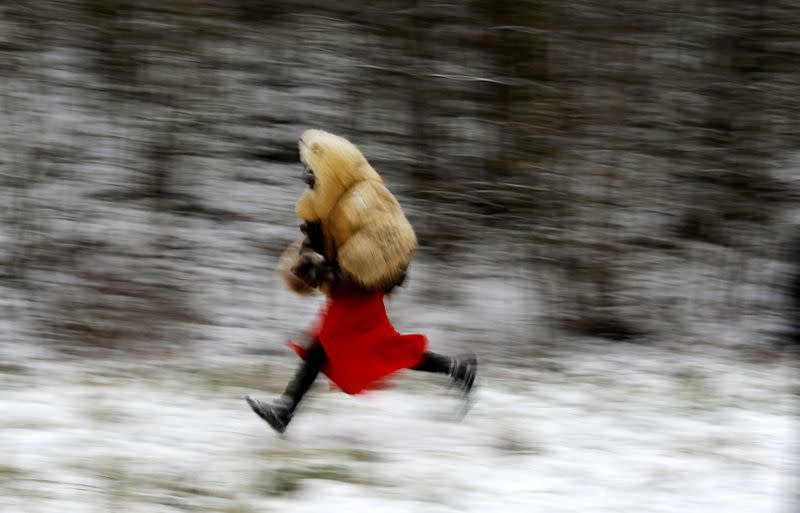 A reveller dressed as devil runs in the village of Valasska Polanka