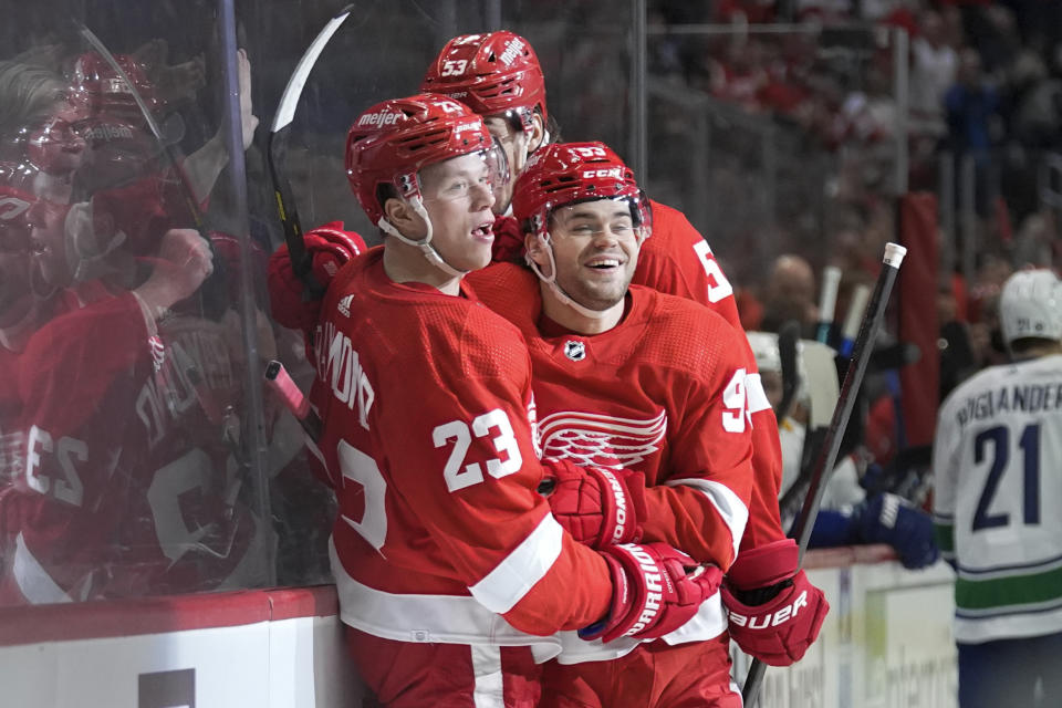 Detroit Red Wings left wing Lucas Raymond (23) celebrates his goal with Alex DeBrincat (93) in the first period of an NHL hockey game Saturday, Feb. 10, 2024, in Detroit. (AP Photo/Paul Sancya)