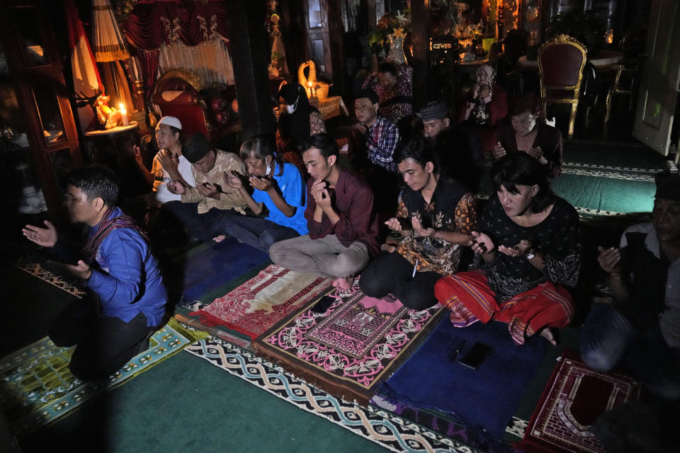 Trans women and activists perform an early evening prayer at Al-Fatah Islamic school in Yogyakarta, Indonesia, Sunday, Nov. 6, 2022. On the outskirts of the Indonesian city that's home to many universities, the small boarding school is on a mission that seems out of place in a nation with more Muslim citizens than any other. Its students are transgender women. (AP Photo/Dita Alangkara)