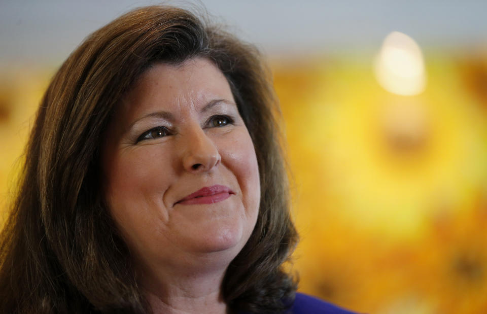 FILE - This May 14, 2014 file photo shows Karen Handel speaking to a reporter in Roswell, Ga. Candidates for a special congressional election in Georgia are demonstrating that Republican squabbling extends well beyond Capitol Hill, while their leading Democratic rival rakes in more than $8 million in campaign cash and eyes an upset that would send ripples through Washington ahead of the 2018 midterms. Handel is one of 11 Republican candidates, five Democrats and two independents, running to succeed Health Secretary Tom Price's seat. (AP Photo/John Bazemore, File)