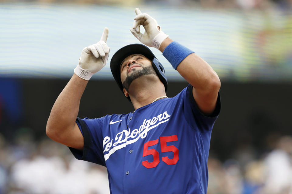 Los Angeles Dodgers' Albert Pujols reacts at the plate after hitting a solo home run against the New York Mets during the first inning of a baseball game in Los Angeles, Saturday, Aug. 21, 2021. (AP Photo/Alex Gallardo)