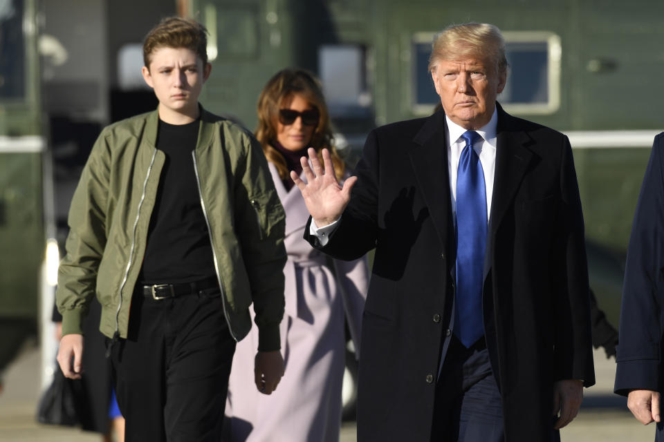 President Donald Trump, first lady Melania Trump and their son Barron Trump walk toward Air Force One at Andrews Air Force Base in Md., Friday, Jan. 17, 2020. The Trumps are heading to Florida to spend the weekend at their Mar-a-Lago estate. (AP Photo/Susan Walsh)