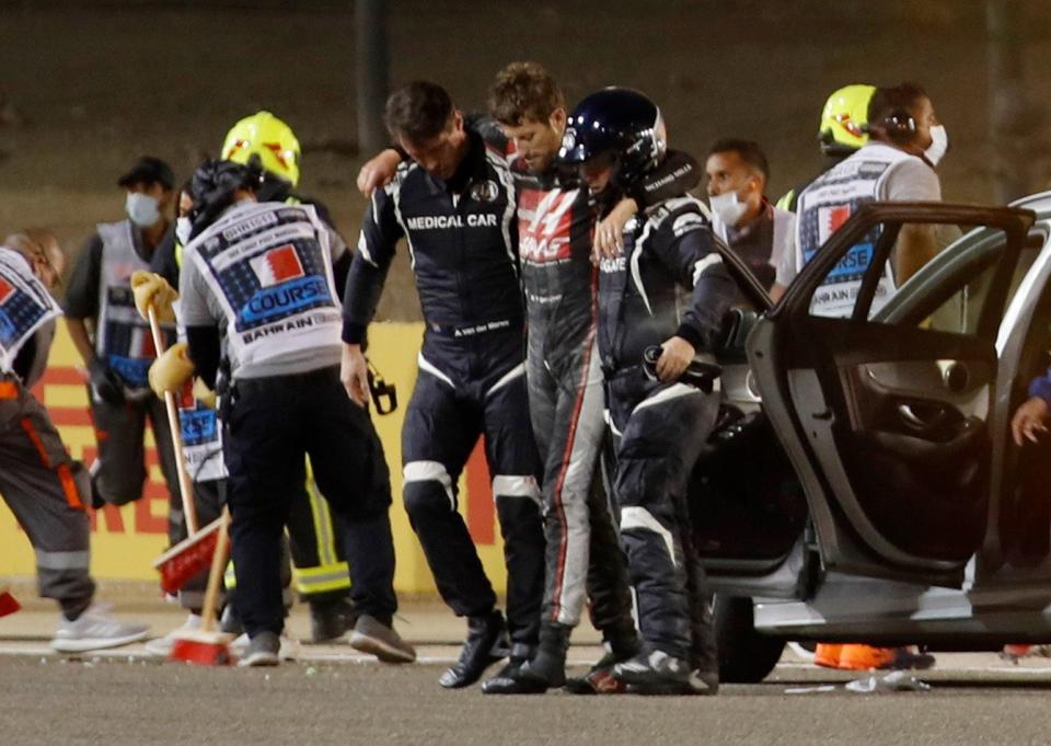 Grosjean was helped away from the scene before being airlifted to hospitalReuters