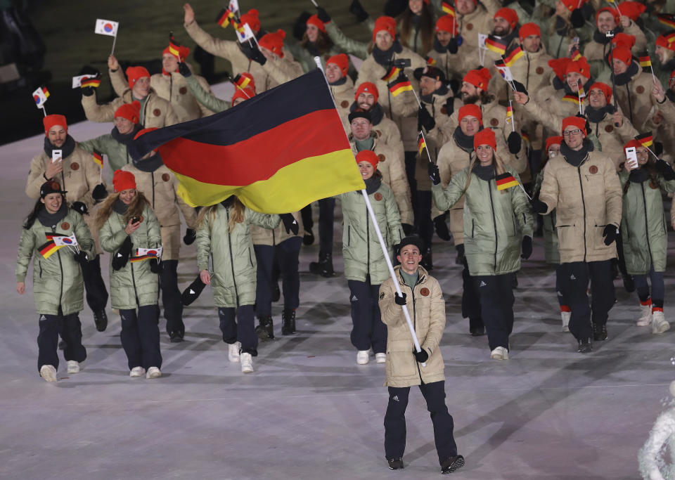 <p>Eric Frenzel carries the flag of Germany during the opening ceremony of the 2018 Winter Olympics in Pyeongchang, South Korea, Friday, Feb. 9, 2018. (AP Photo/Michael Sohn) </p>