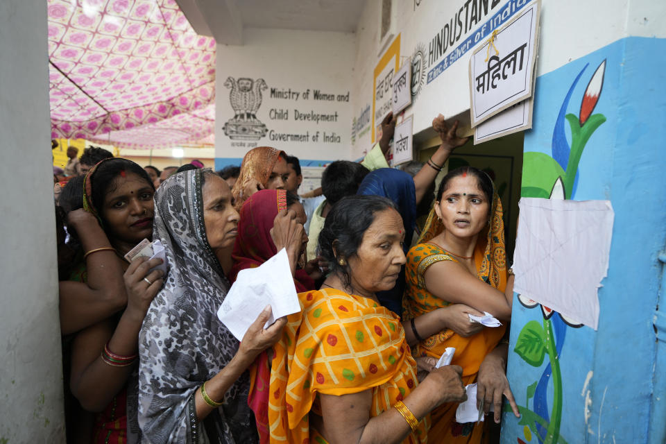 Women stand in queue to cast their votes in the seventh and final phase of national elections, in Varanasi, India, Saturday, June 1, 2024. Indians began voting Saturday in the last round of a six-week-long national election that is a referendum on Hindu nationalist Prime Minister Narendra Modi's decade in power. (AP Photo/Rajesh Kumar Singh)