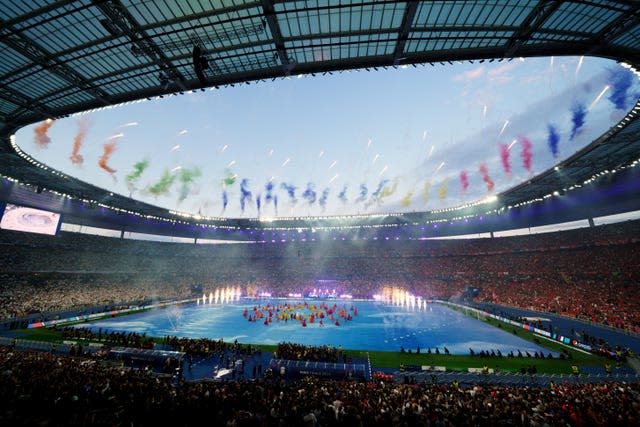 Fireworks fly around the Stade de France as dancers perform before the 2022 Champions League final between Liverpool and Real Madrid