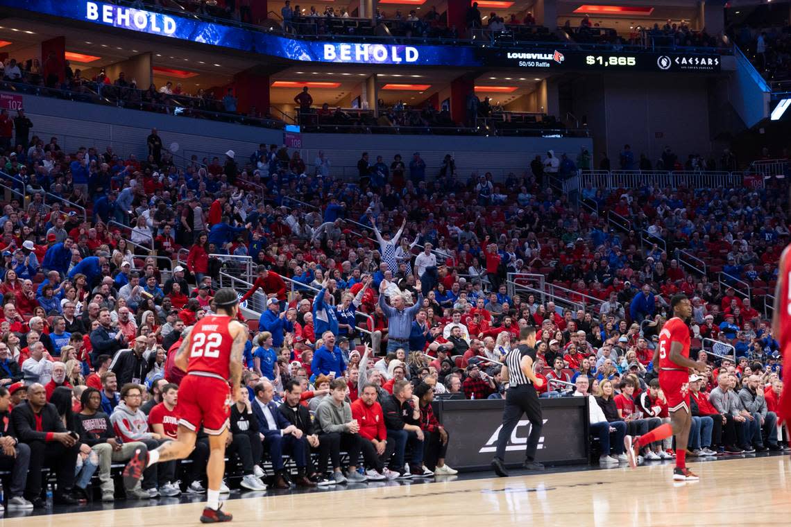 Kentucky fans react after UK guard Antonio Reeves made a 3-point shot against Louisville during Thursday’s game at the KFC Yum Center. Silas Walker/swalker@herald-leader.com