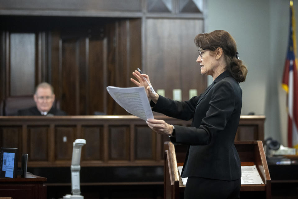 Prosecutor Linda Dunikoski, right, argues a motion before Superior Court Judge Timothy Walmsley, left, during a motion hearing in the trial of Greg McMichael and his son, Travis McMichael, and a neighbor, William "Roddie" Bryan the Glynn County Courthouse, Thursday, Nov. 4, 2021, in Brunswick, Ga. The three are charged with the February 2021 slaying of 25-year-old Ahmaud Arbery. (AP Photo/Stephen B. Morton, Pool)