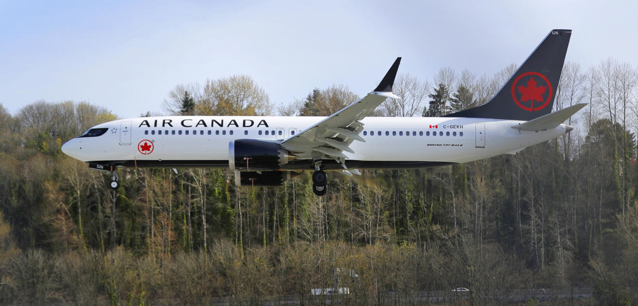 A Boeing 737 MAX 8 operated by Air Canada lands Wednesday, March 27, 2019, at Boeing Field in Seattle. The Federal Aviation Administration plans to revamp oversight of airplane development after the two deadly crashes of 737 Max 8 airplanes, according to testimony prepared for a Capitol Hill hearing on Wednesday. (AP Photo/Ted S. Warren)