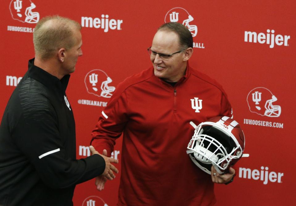 Indiana football coach Tom Allen (right) shakes hands with Kalen DeBoer during a Jan. 25 news conference announcing DeBoer as the team’s offensive coordinator. (Jeremy Hogan / Herald-Times)