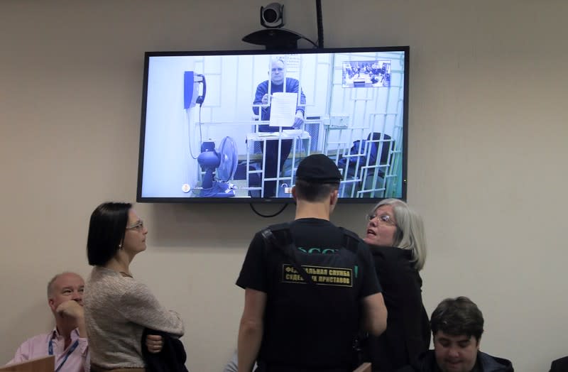 Former U.S. marine Whelan is seen on a screen via a video link during a court hearing in Moscow