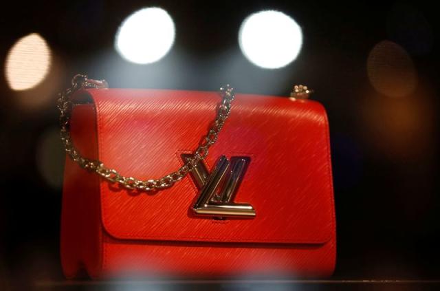 FILE--A Chinese employee looks on in a Louis Vuitton (LV) store in  Shanghai, China, 18 October 2012. More than half of all Louis Vuitton  purchases Stock Photo - Alamy