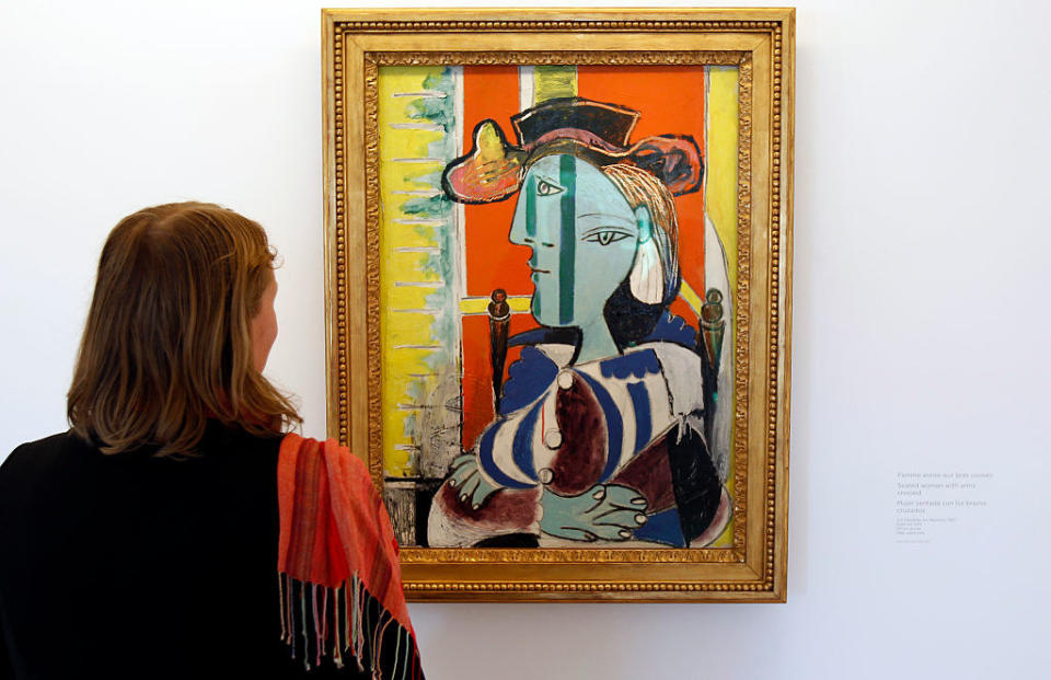 A person looking at a Picasso painting