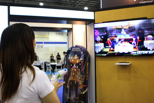 Playing a gun game at the Sushi Police booth. ((Photo: Sharlene Sankaran/Yahoo Singapore)