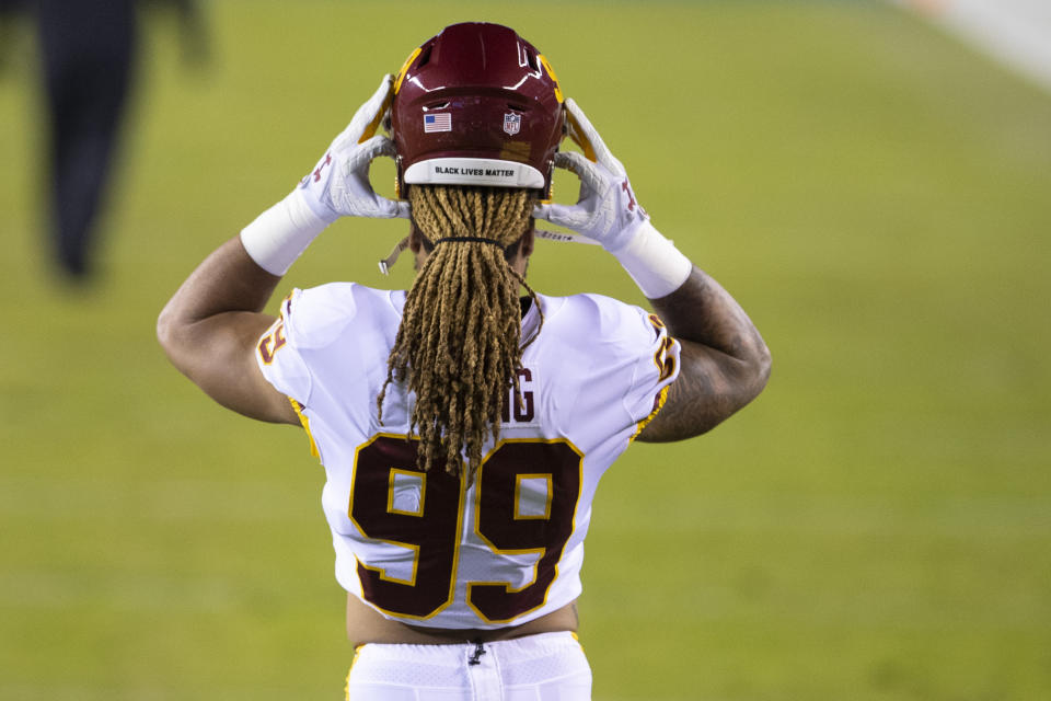 PHILADELPHIA, PA - JANUARY 03: Chase Young #99 of the Washington Football Team puts on his helmet prior to the game against the Philadelphia Eagles at Lincoln Financial Field on January 3, 2021 in Philadelphia, Pennsylvania. (Photo by Mitchell Leff/Getty Images)