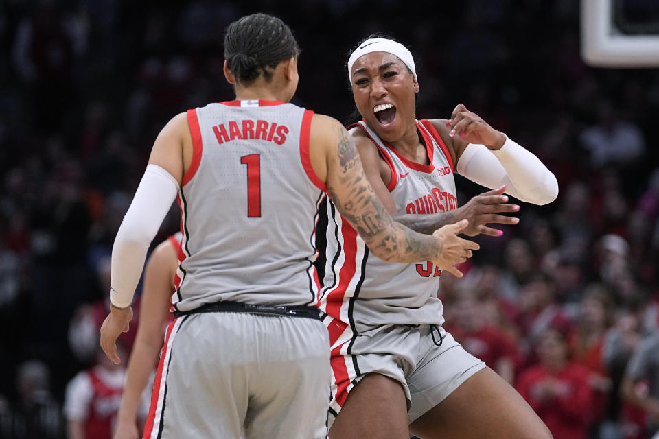 Ohio State guard Rikki Harris (1) and forward Cotie McMahon, right, celebrate during the second half of the team's NCAA college basketball game against Nebraska, Wednesday, Feb. 14, 2024, in Columbus, Ohio. (AP Photo/Sue Ogrocki)