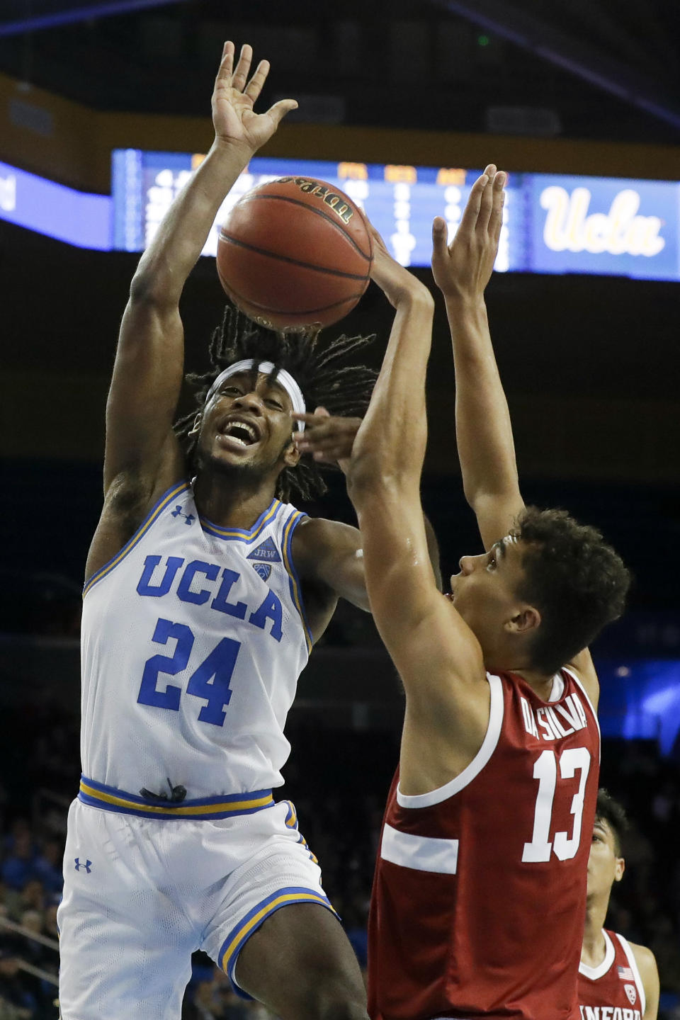 Stanford forward Oscar da Silva, right, blocks a shot by UCLA forward Jalen Hill during the second half of an NCAA college basketball game in Los Angeles, Wednesday, Jan. 15, 2020. (AP Photo/Chris Carlson)