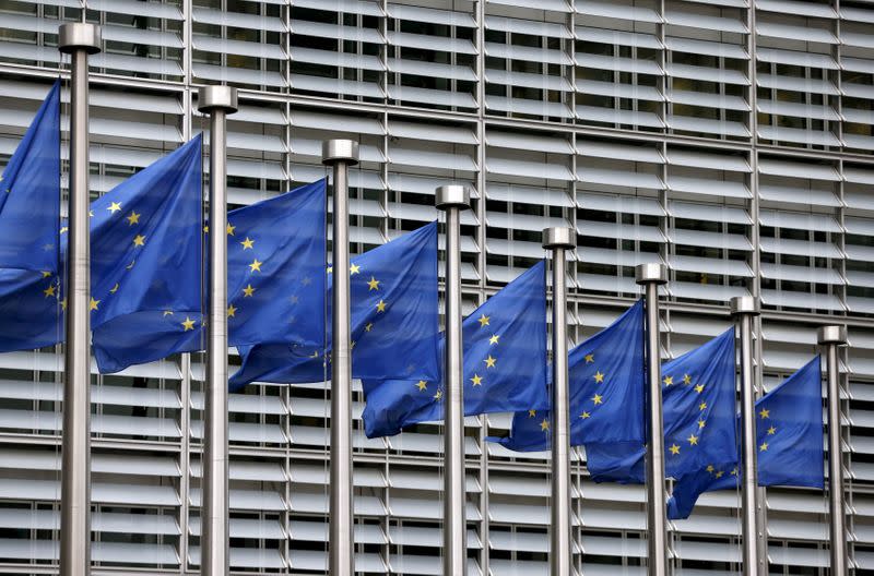 FILE PHOTO: Picture shows European Union flags fluttering outside the EU Commission headquarters in Brussels